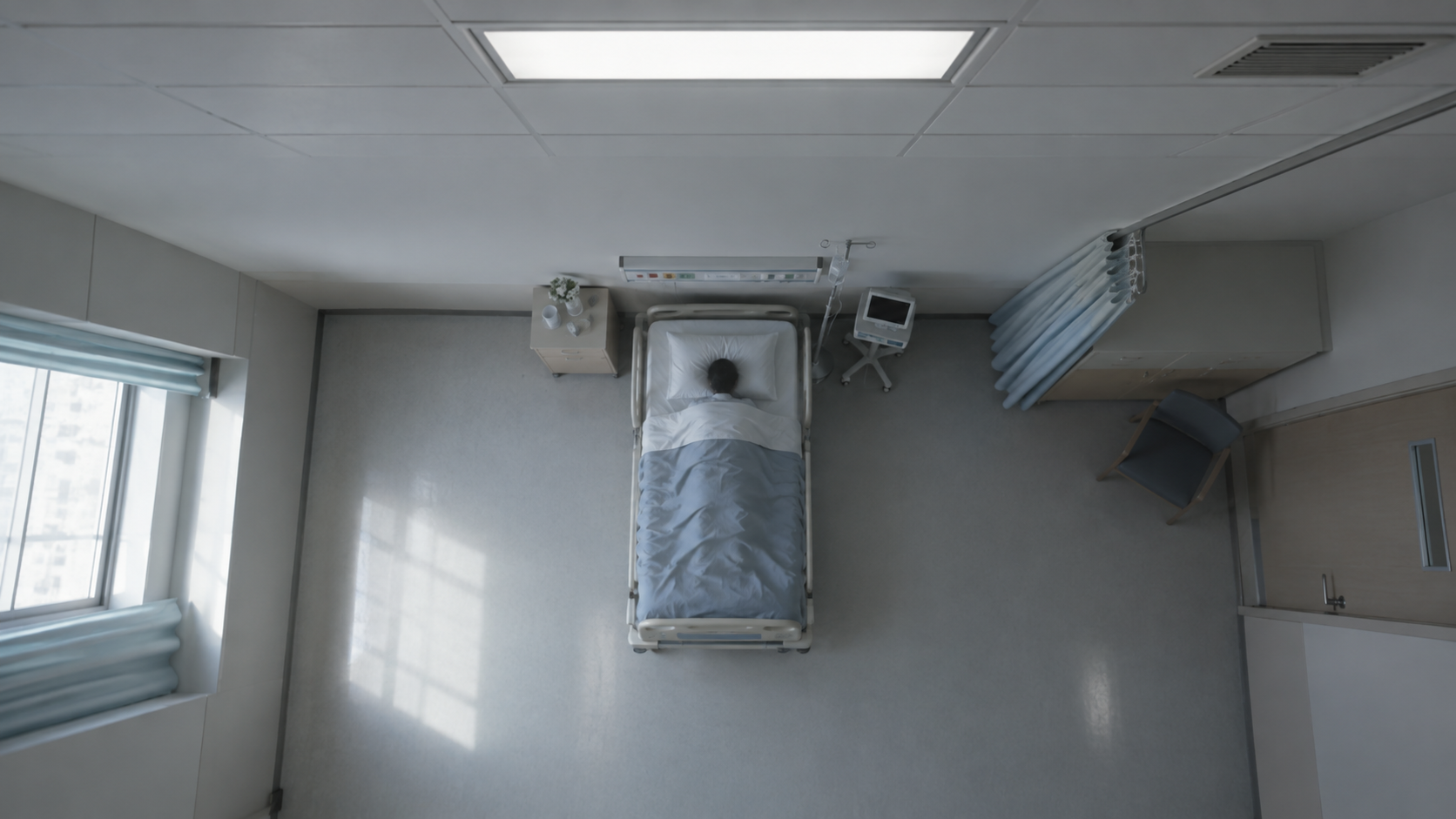 A restrained overhead perspective of a hospital bed